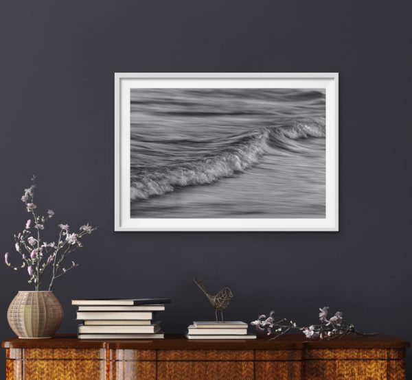Abstract black and white photo of the ocean in a white frame