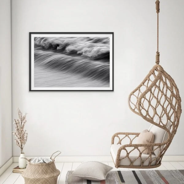 Abstract black and white photo of the ocean in a black frame