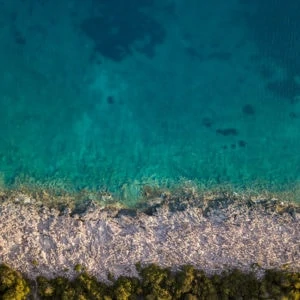 Aerial photo of coda (water) and ocean shoreline in Croatia