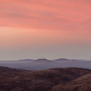 Alps Sunrise - A soft alpine sunrise dusts the rolling peaks of Kosciuszko National Park, Australia