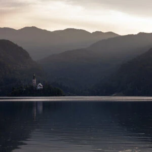 Bled - The late afternoon glow lights up the iconic church on the small island in Lake Bled, Slovenia.
