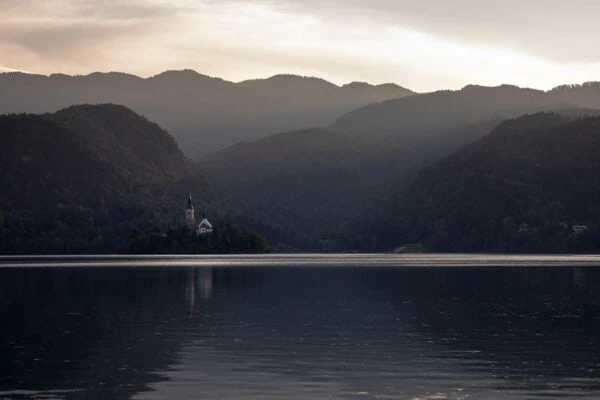 Bled - The late afternoon glow lights up the iconic church on the small island in Lake Bled, Slovenia.