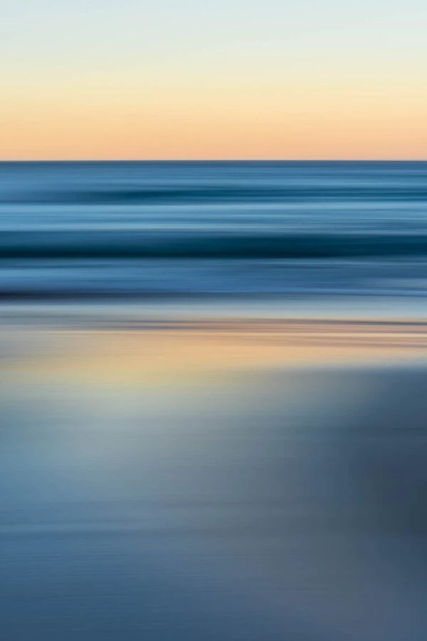Bluestrokes - Cool ocean tones contrast with the peachy pre-dawn glow. South Coast, Australia