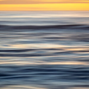 An abstract photo of the ocean which resembles brushstrokes.