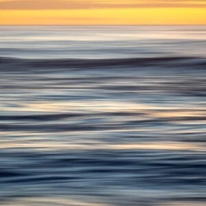 An abstract photo of the ocean which resembles brushstrokes.